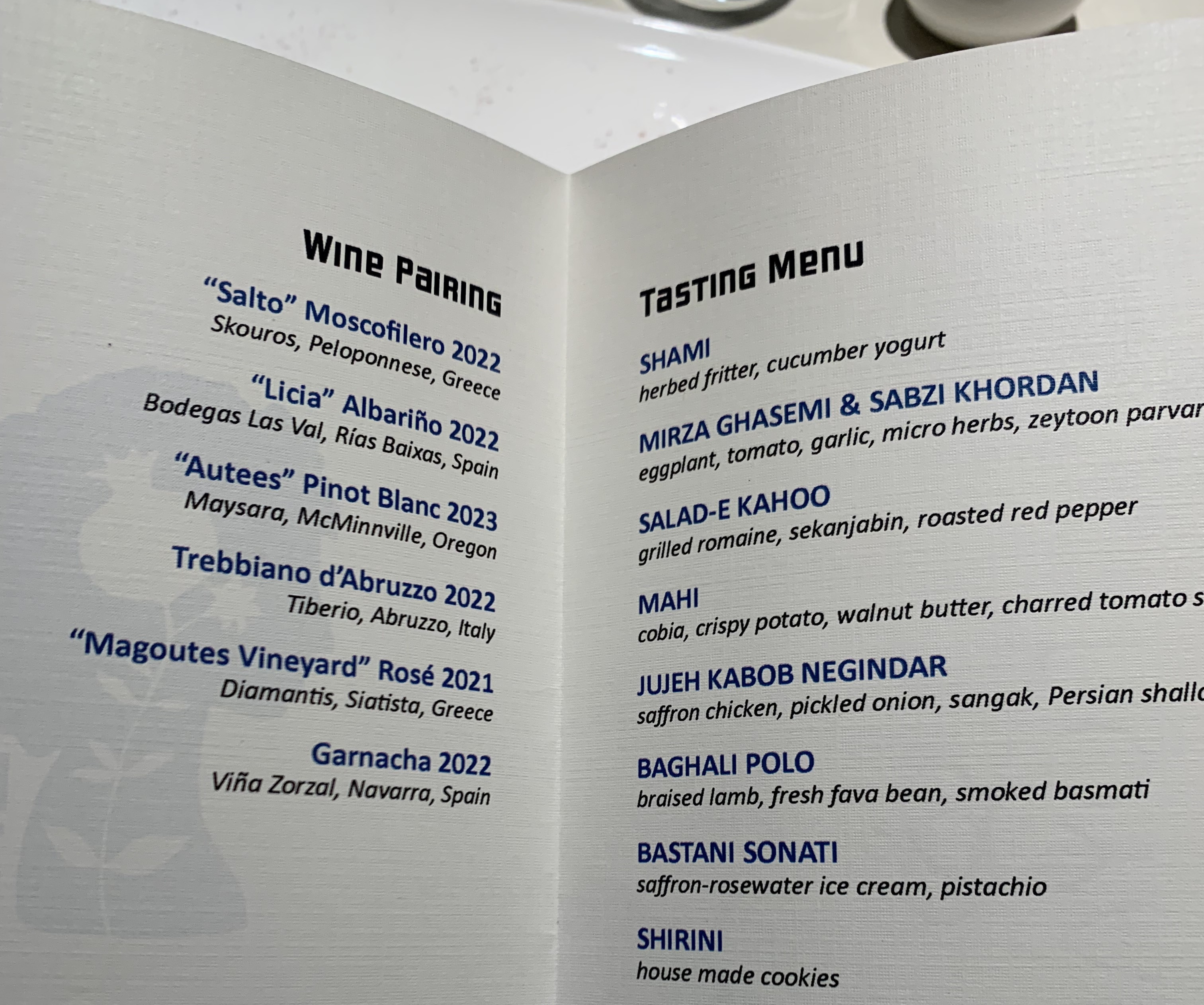 A menu listing all the courses and the wine pairings