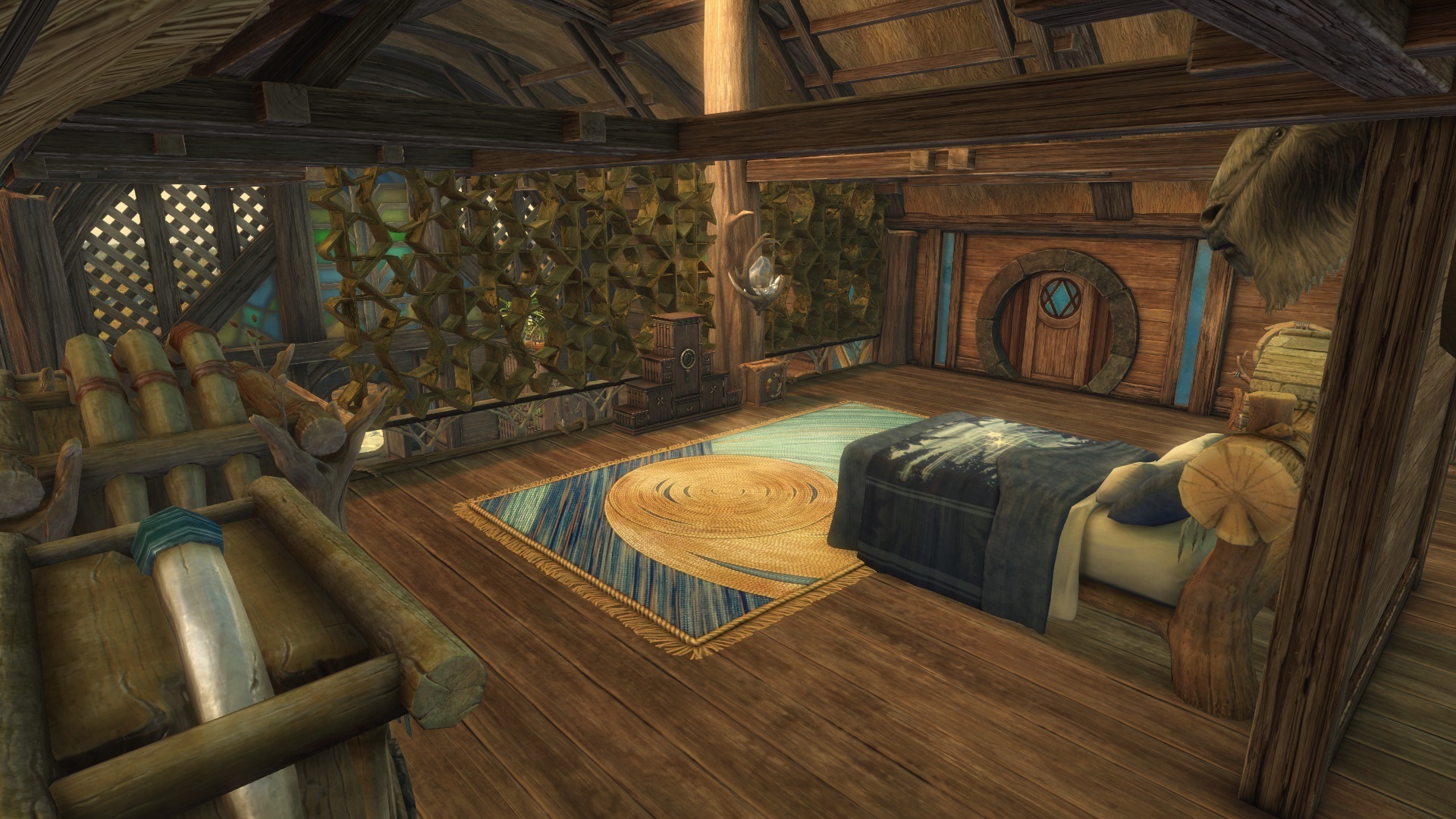 A bedroom on the 2nd floor, with a large bed, a stuffed dolyak head mounted above the bed, and ample storage.