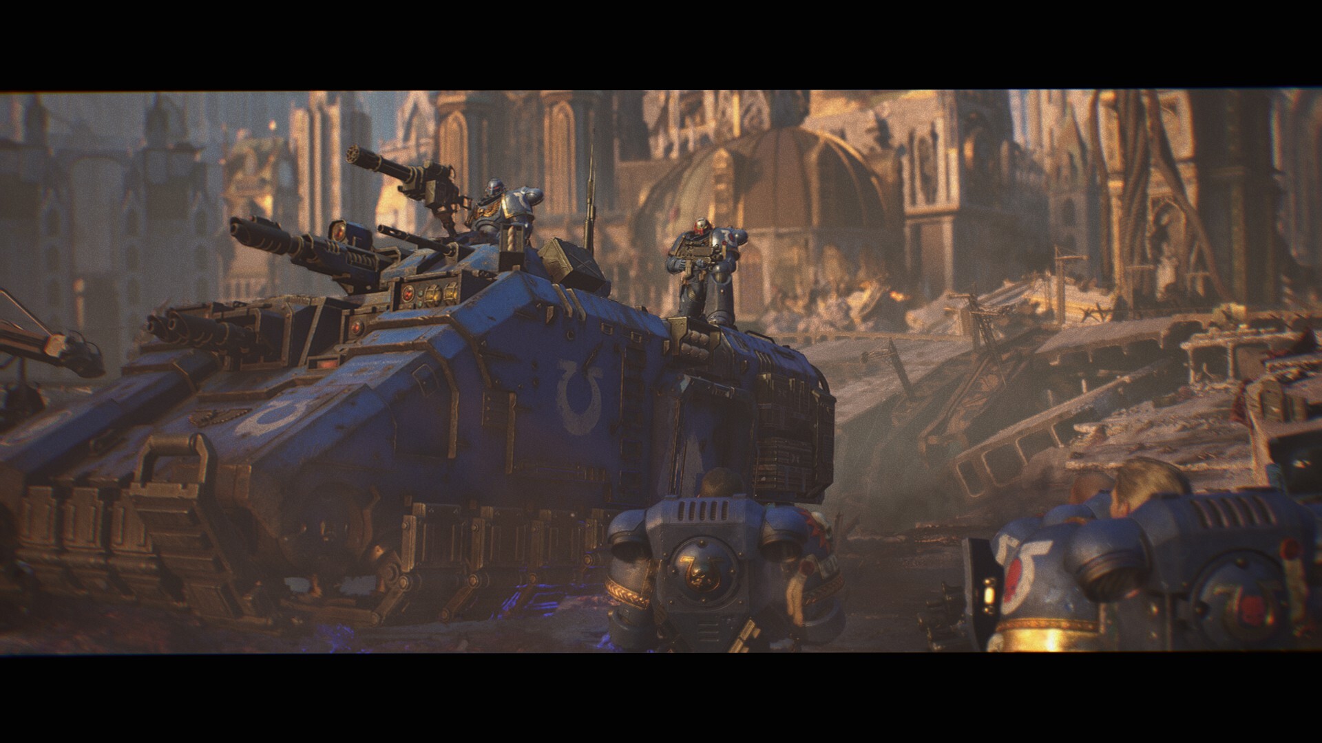 An ultramarines tank with lots of guns. Several marines are standing on it.