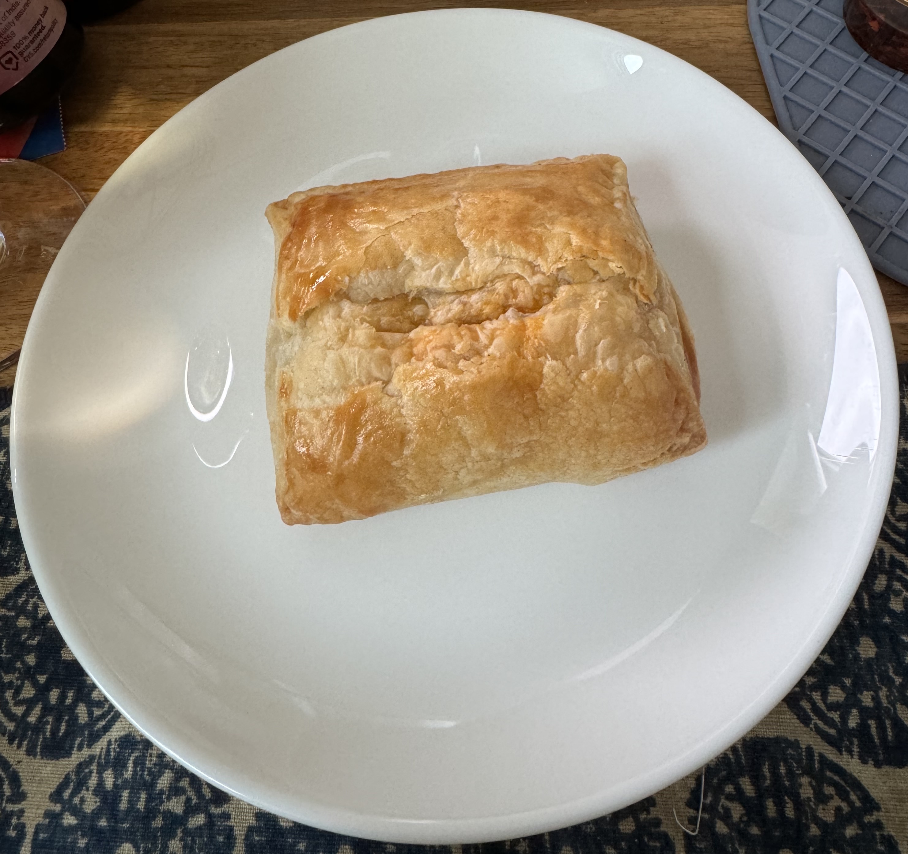 Golden brown rectangle of pastry dough. It looks flaky and fluffy.