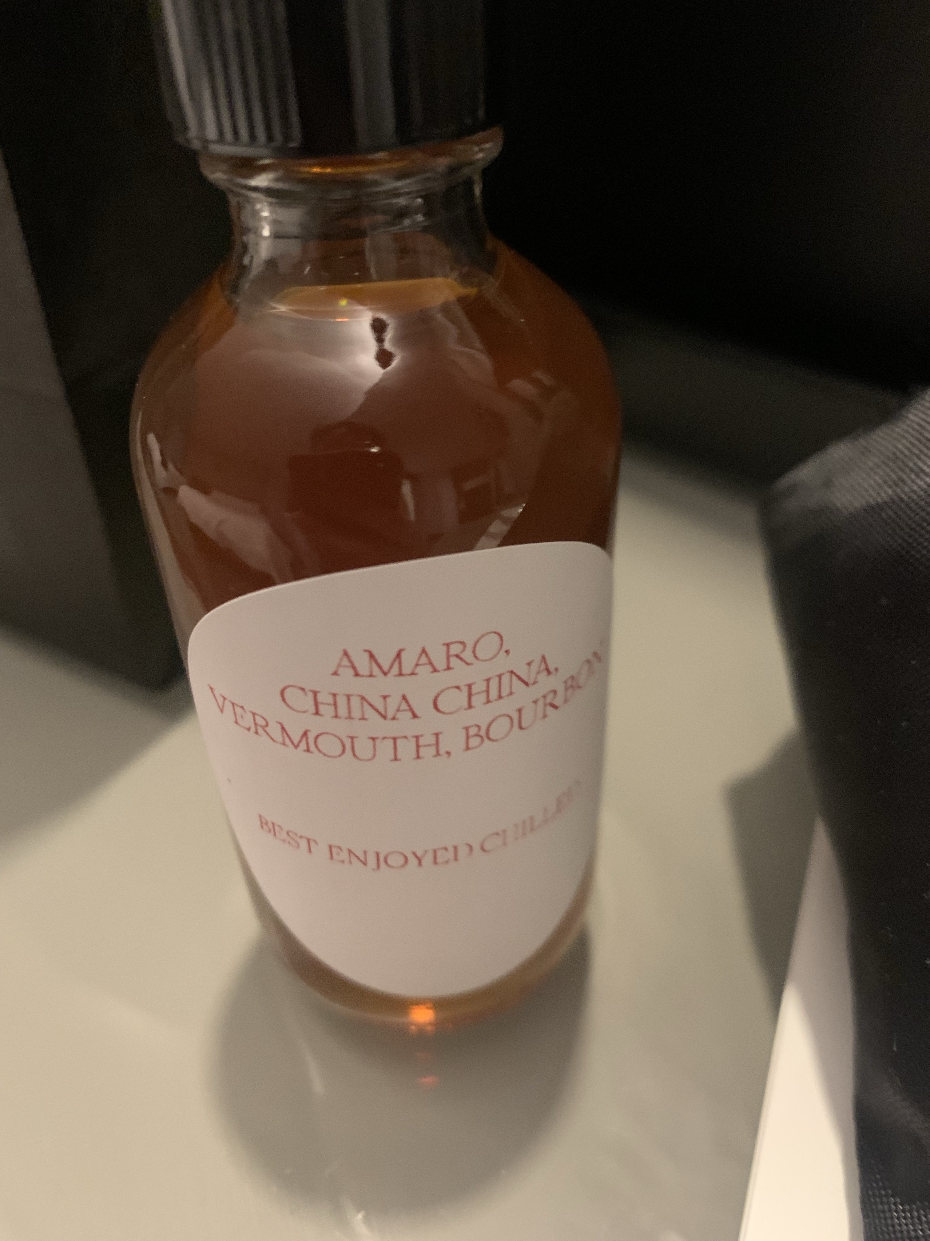 Bottled cocktail, with the ingredients listed as amaro, china china, vermouth, and bourbon. Best served chilled.