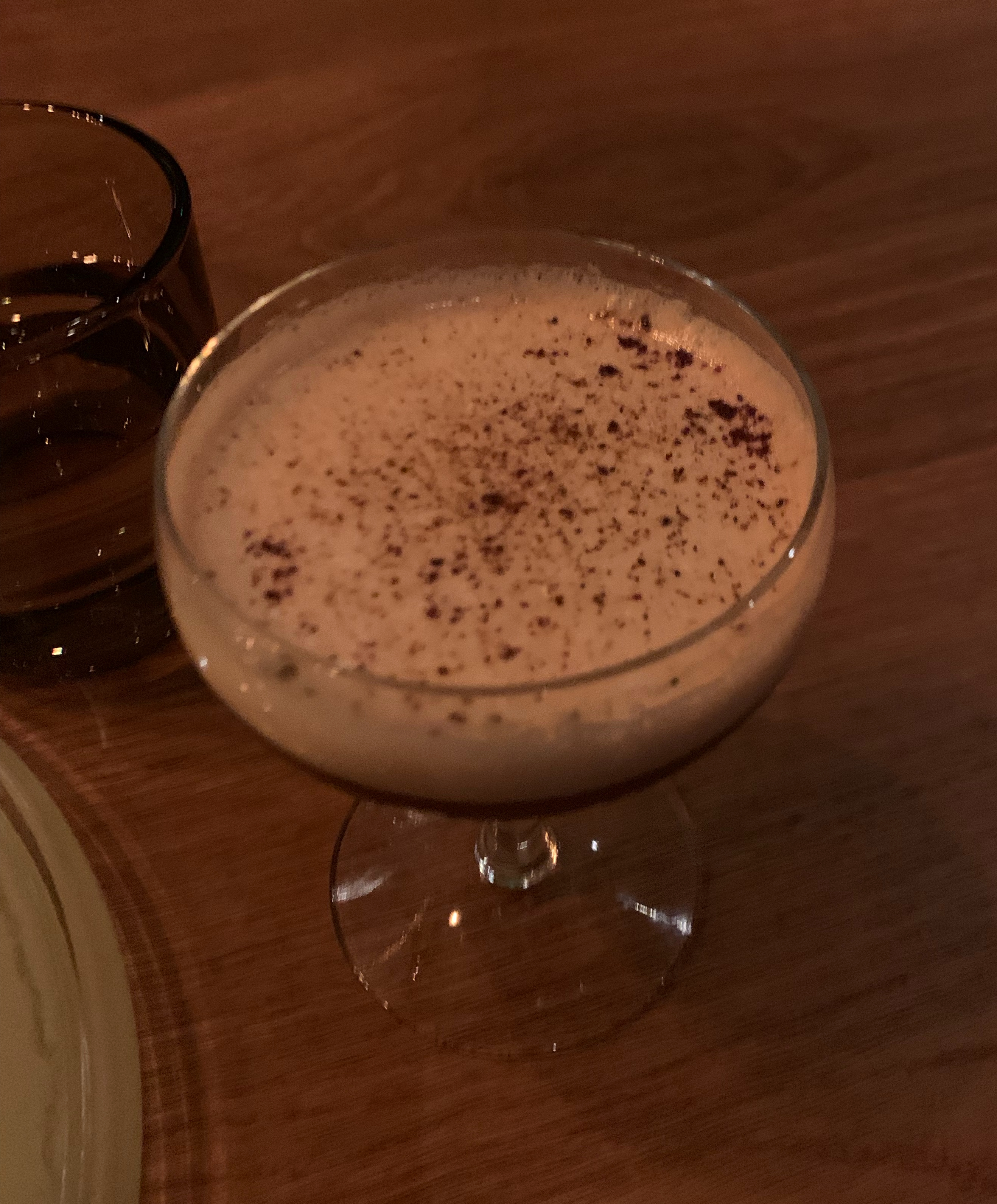 Frothy espresso martini served in a coupe